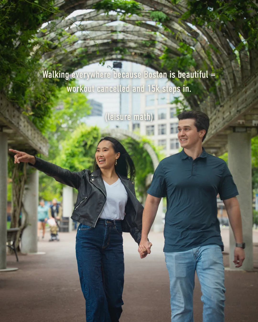 Couple walking under a green Boston archway: walking everywhere means the workout is cancelled